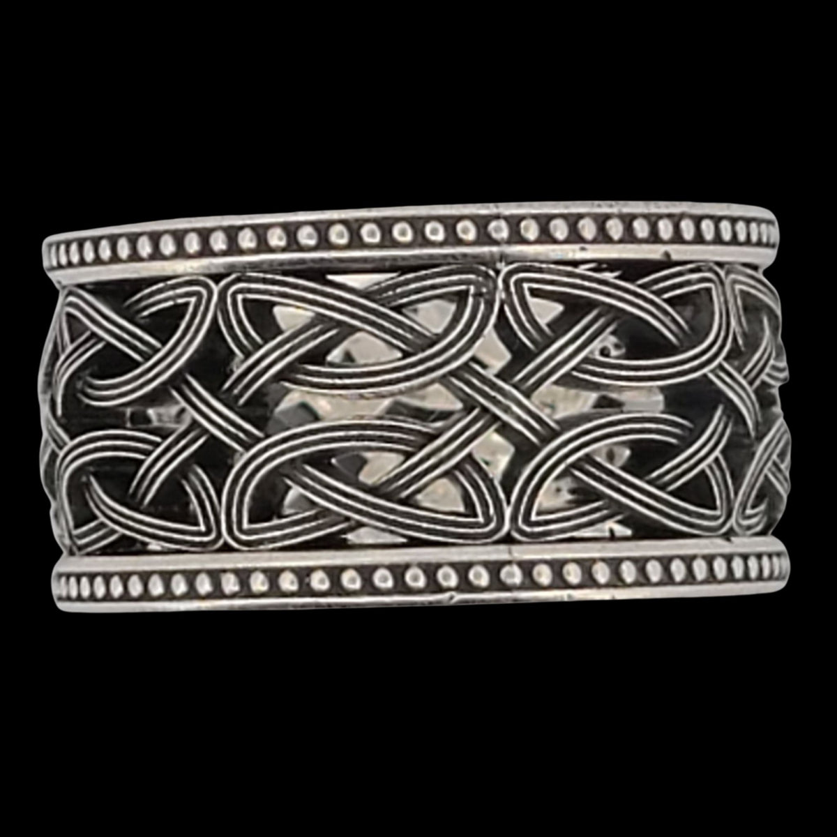 a silver ring with an intricate design